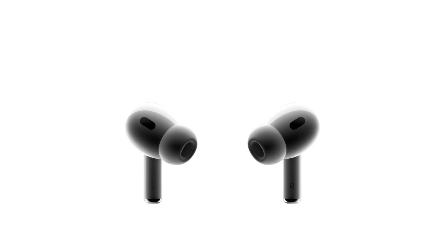 Två vita AirPods Pro-öronsnäckor som är vända mot varandra. Örontoppar i silikon är fästa på de kompakta öronsnäckorna med svart nät på.