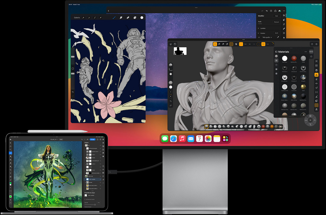 iPad Pro fixé à un Magic Keyboard en mode paysage, connecté à un écran externe, des images en cours de modification sur les deux écrans