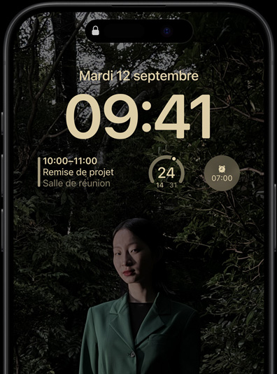 The Always-On display of iPhone 15 Pro showcasing a Lock Screen with a calendar widget, a weather widget, and an alarm widget