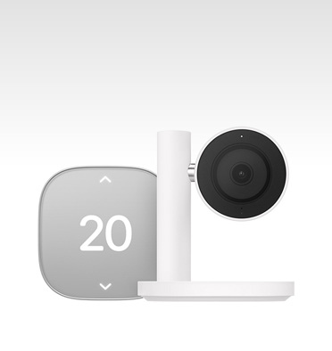 Apple Home Collection smart home thermostat, silver color, displaying temperature of 20 degrees Celsius, Apple Home Collection smart home camera, black lens and surround mounted on a white stand and arm
