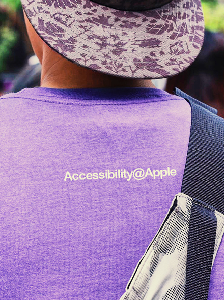 Photo of someone from behind, wearing a T-shirt that says, “Accessibility@Apple.”