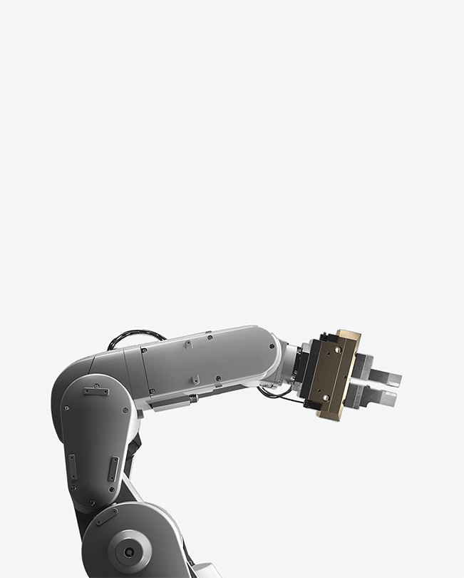 Partial view of a robot’s arm against a white background.