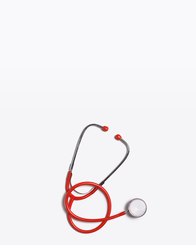 Red stethoscope on a white background.