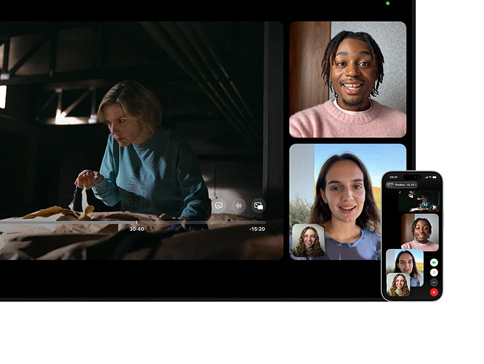 Mac und iPhone: Split View mit SharePlay auf dem Mac, eine Apple TV Serie wird auf der linken Seite wiedergegeben, FaceTime Fenster auf der rechten Seite zeigen drei Personen, das iPhone, das neben dem Mac befestigt ist, wird als Integrationskamera verwendet