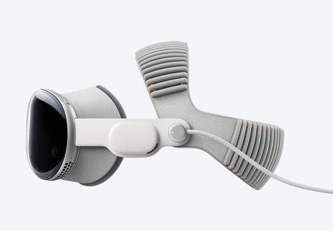 Side view of Apple Vision Pro aluminum alloy frame, assembled with Light Seal, Audio Strap, built-in power cable, and Dual Knit Band