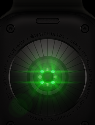 Apple Watch Ultra 4 tagakülg, titaanist korpus, must, mitu ümarat andurit helendavate roheliste LED-tuledega