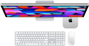 Mac mini paigutatud Studio Display alla, numbriklahvistikuga Magic Keyboard, Magic Mouse