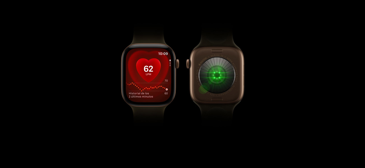 Dos Apple Watch Series 12, caja de aluminio, color bronce oscuro, correa deportiva verde oliva, uno muestra la parte delantera del reloj con la app Frecuencia Cardiaca, el otro muestra la parte trasera del reloj con el sistema de medición de salud con luces LED verdes brillantes