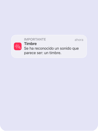 Un iPhone muestra una notificación con el mensaje «Se ha reconocido un sonido que parece ser: un timbre» basado en el sonido en tiempo real.