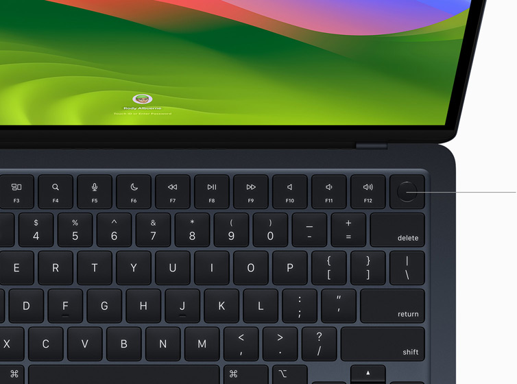Bovenaanzicht van MacBook Air, waarop met Touch ID op het Magic Keyboard wordt betaald met Apple Pay.