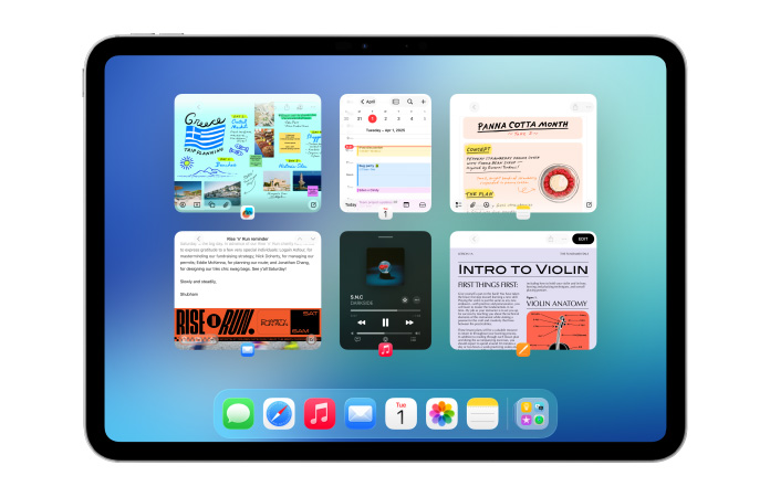 Un iPad, orientation paysage, l’écran affiche plusieurs apps comme Calendrier et Musique dans six fenêtres disposées équitablement sur deux rangées.