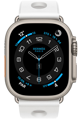 Apple Watch Hermès Ultra 3, boîtier en titane, naturel, cadran Hermès Circulaire, complications : météo, anneaux Activité, heure de Paris, index UV, bracelet Scub’H Diving, blanc