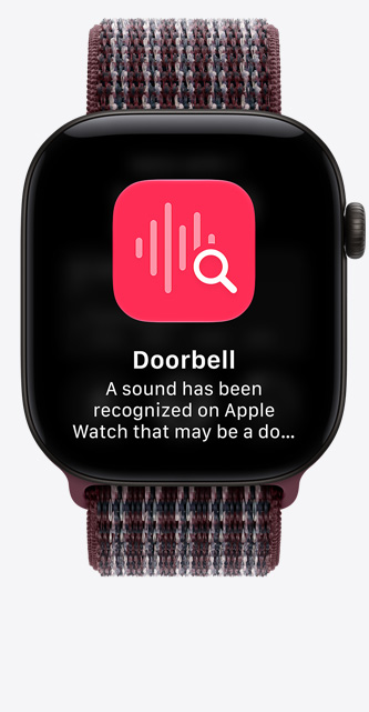 Apple Watch Series 12 fekete alumíniumtokkal, rögzített beszélgetés a kijelzőn, burgundi kockás sportpánt