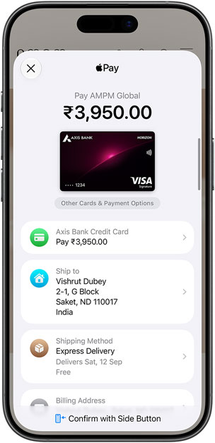 iPhone, front, displaying an Apple Pay payment sheet, with as Axis Bank credit card, shipping and delivery details, and a “Confirm with Side Button” prompt