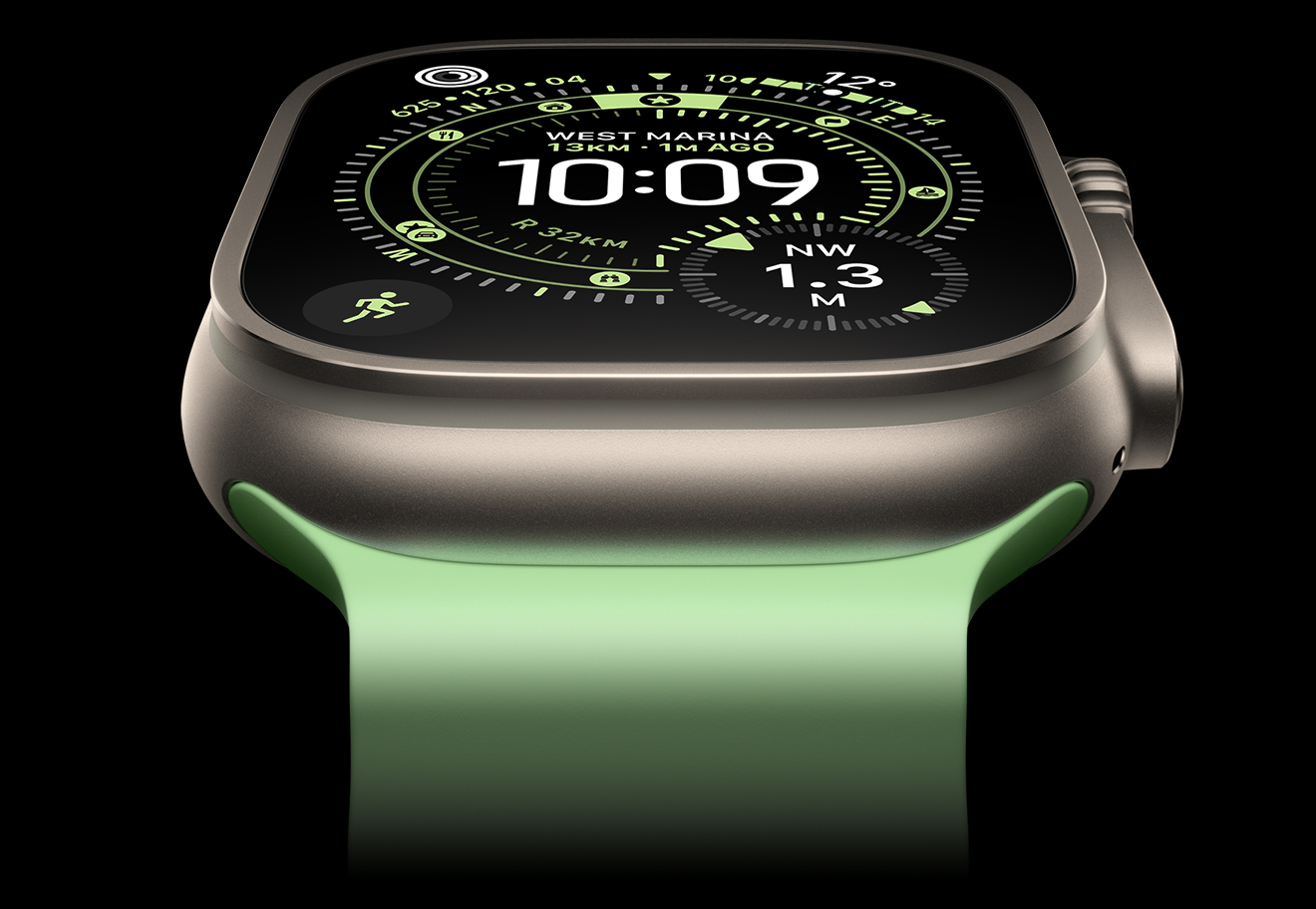 A close-up of a Natural Titanium Apple Watch Ultra 3 on a black background. The display shows the time and other dynamic info.