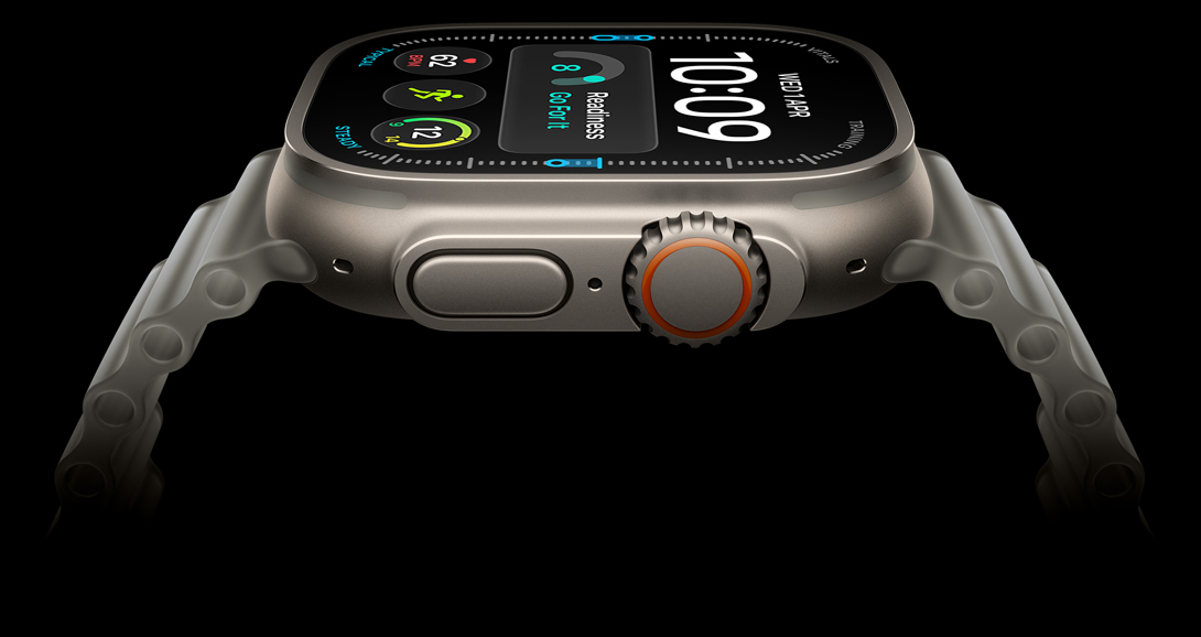 Apple Watch Ultra 4, titanium case, natural color, digital clock face, complications: readiness, heart rate, Workouts, UV, right side exterior, Digital Crown, raised side button, Ocean Band, translucent gray color