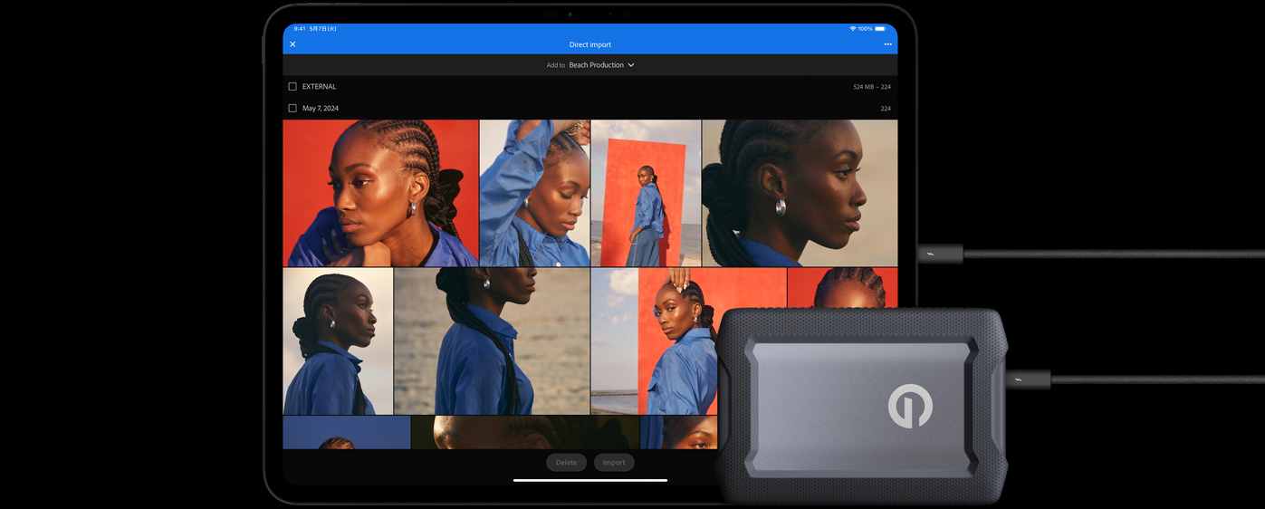 横向きのiPad Pro、画面に複数の写真が表示されている。iPadの手前にケーブルで接続された外付けハードドライブがある