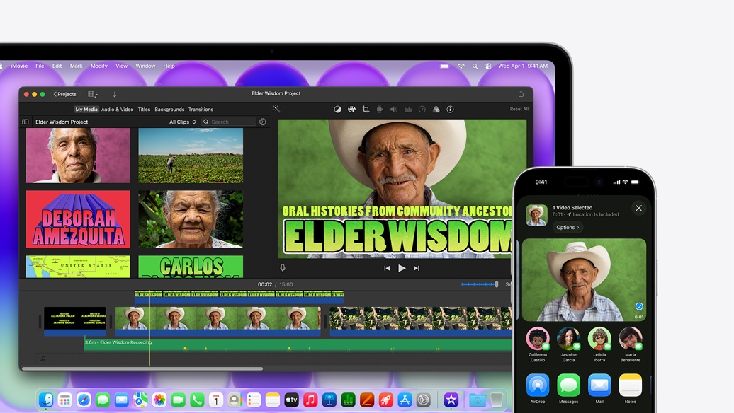 Sidabro spalvos „MacBook Neo“, kuriame rodomas „iMovie“ langas su pavadinimu „Elder Wisdom Project“, šalia esančiame „iPhone“ rodomas vaizdo įrašas su vienu iš „iMovie“ lange pavaizduotų žmonių, po vaizdo įrašu yra bendrinimo parinkčių sąrašas, įskaitant „AirDrop“
