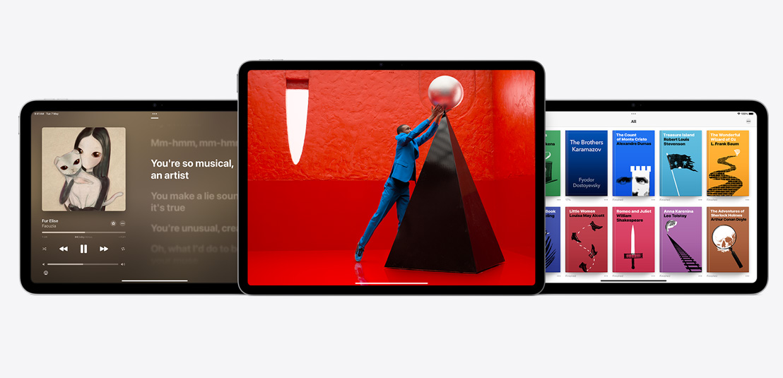 Two iPads and an iPad Air showcasing the Apple Music, Apple TV+, and Apple Books apps.