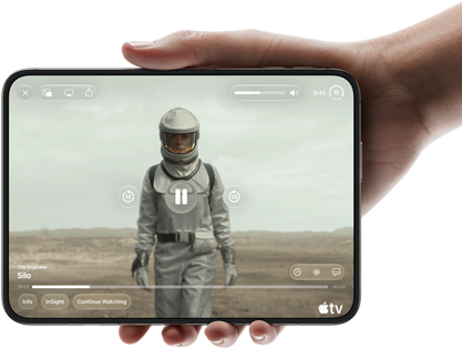 iPhone Duo, held with one hand, opened in horizontal orientation, fully unfolded, interior screen displays Apple TV show 'Silo'