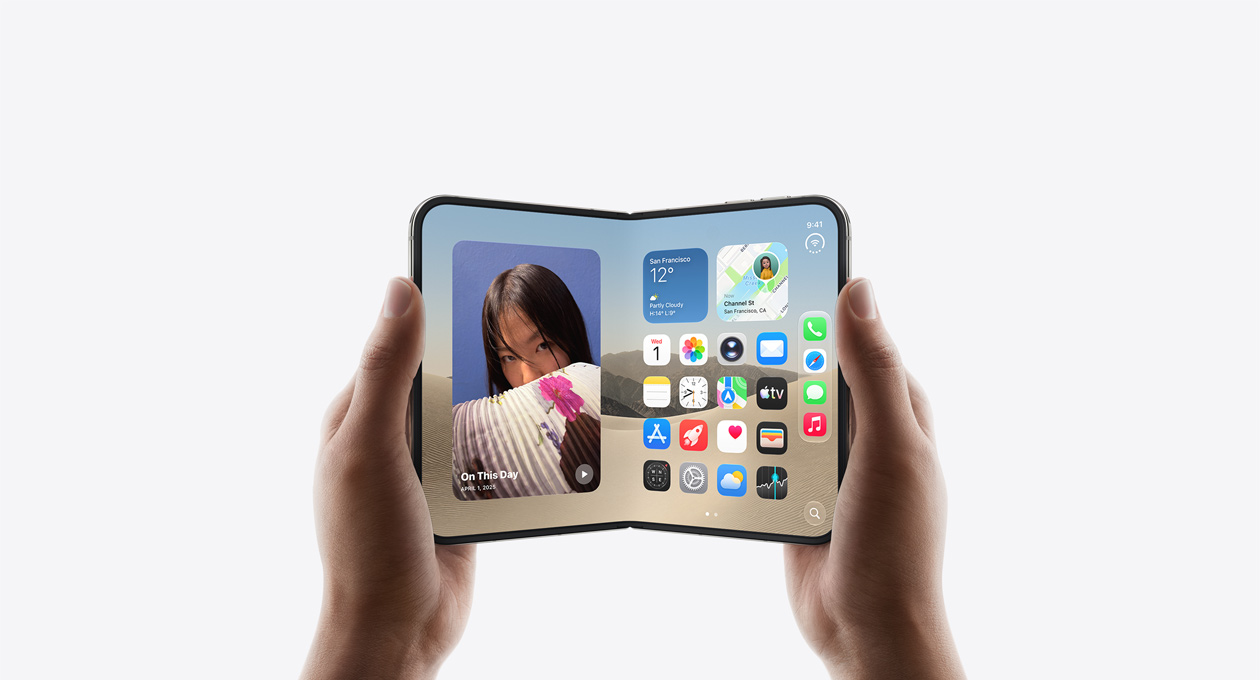 iPhone Duo, held by two hands in open landscape position, inside exterior, Star White color, iOS home screen display, photos on the left, apps on the right