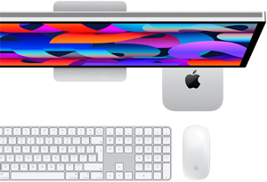 Mac mini tucked under Studio Display, Magic Keyboard with Numeric Keypad, Magic Mouse