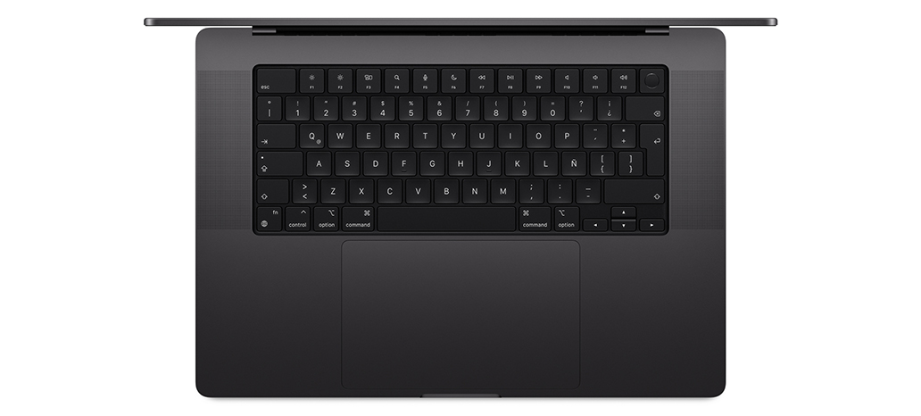Vista desde arriba de una MacBook Pro que muestra el Magic Keyboard integrado con Touch ID y trackpad 