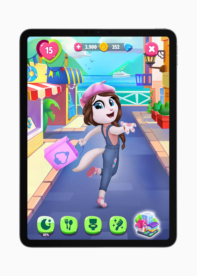Angela the cat prances down a street in a still from the game My Talking Angela 2+ on iPad.