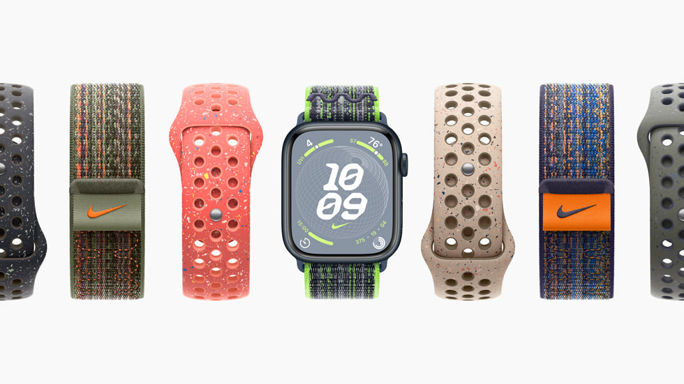 Sieben Apple Watch Series 9 Modelle, die verschiedene Nike Sport Loops und Nike Sportarmbänder mit unterschiedlichen Farbschemen zeigen.