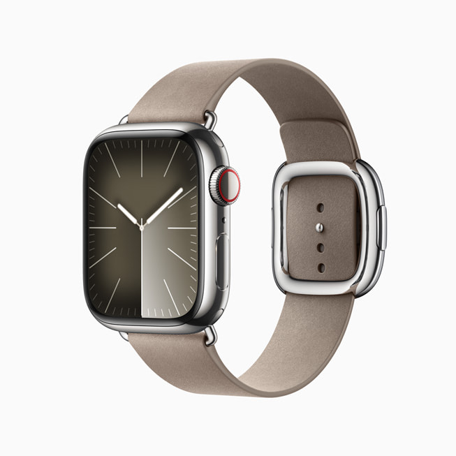 Apple Watch Series 9 in stainless steel in silver with a grey FineWoven Modern Buckle band.