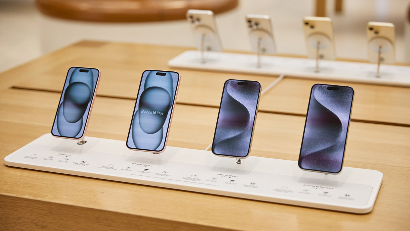 The iPhone 15 lineup on a display table at Apple Regent Street in London.