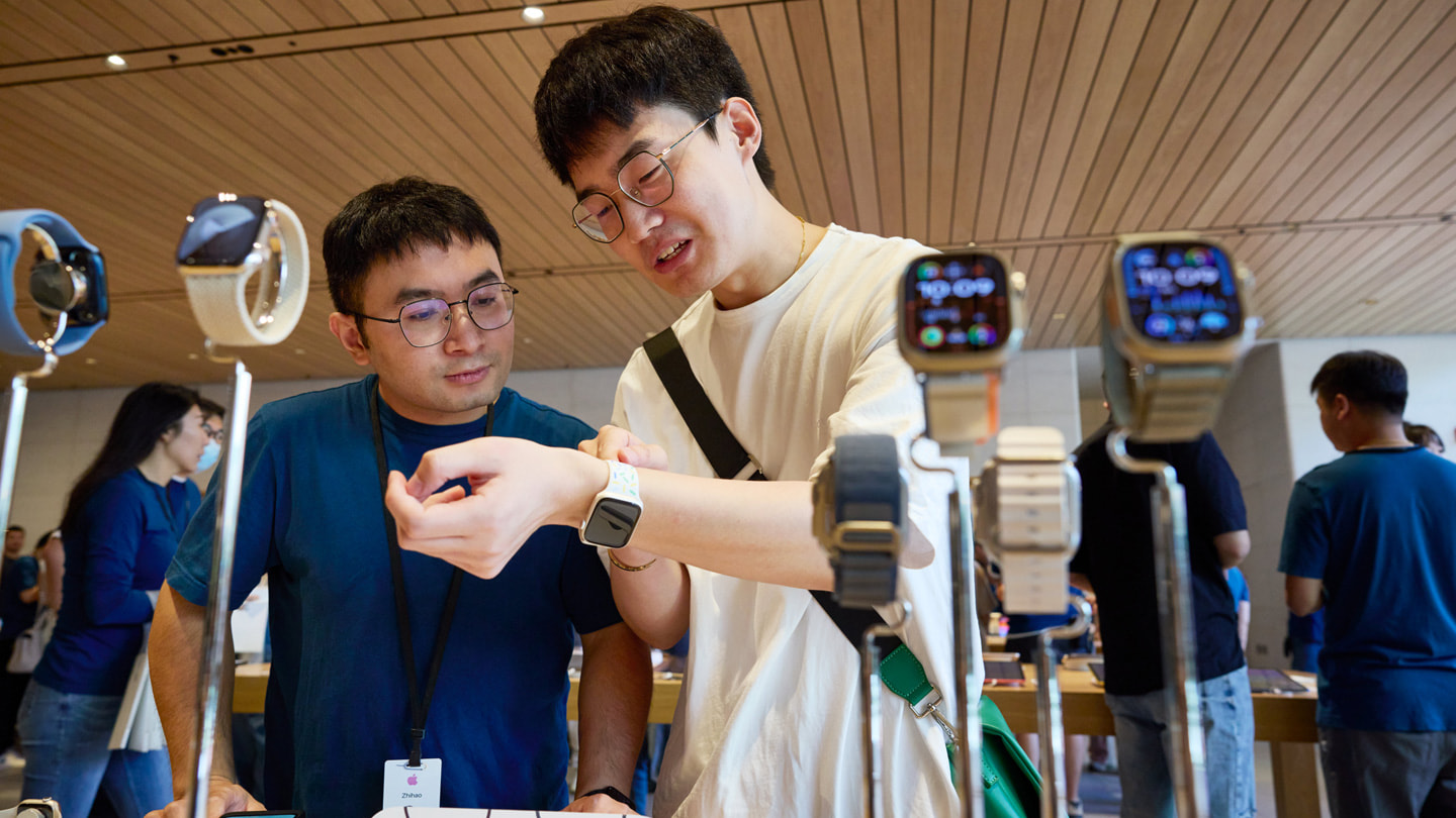 A customer tries on the new Apple Watch Series 9.