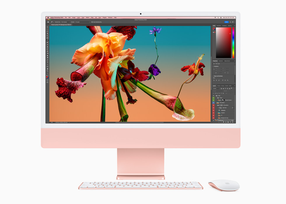 Adobe Photoshop op een nieuwe roze iMac met M3, met een toetsenbord en muis in bijpassende kleur.