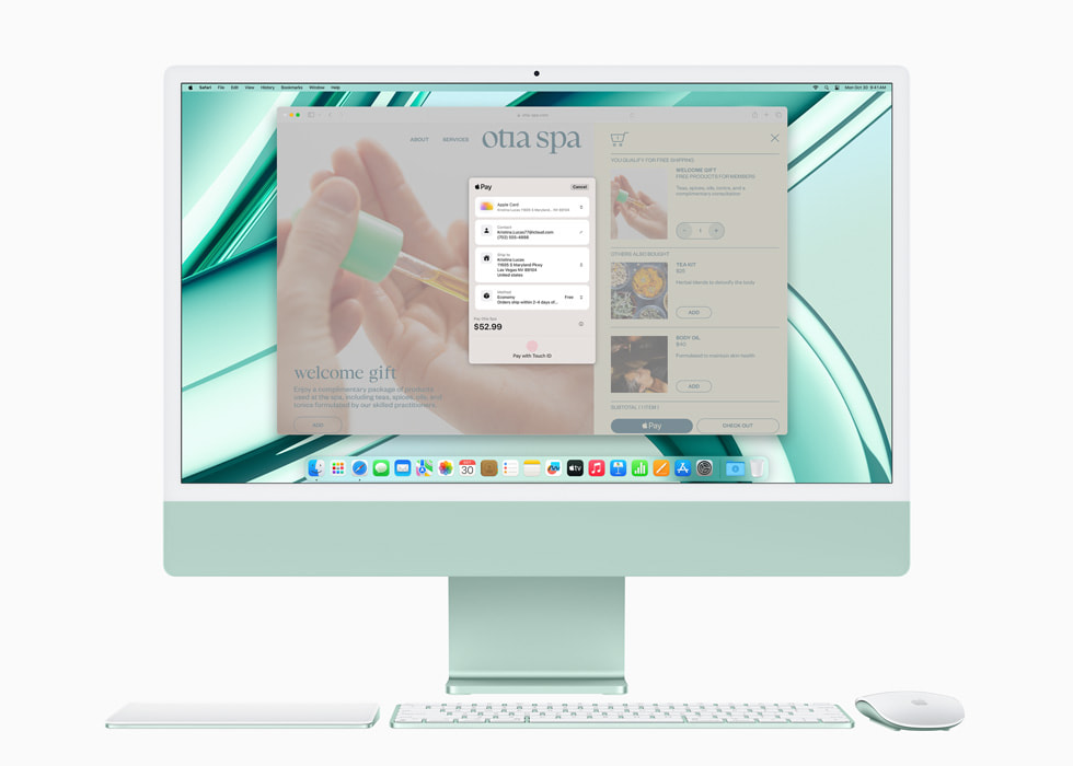 Apple Pay 顯示在搭載 M3 的綠色新款 iMac 上，並展示與 iMac 顏色搭配的鍵盤和滑鼠。