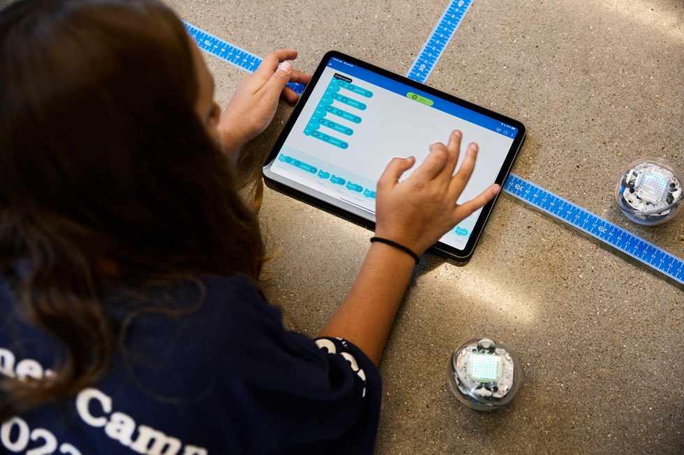 A student uses iPad to program a Sphero robot at the Houston Community College technology summer camp.