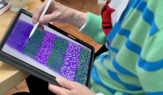 Hockney’s hands are shown using iPad Pro and Apple Pencil.
