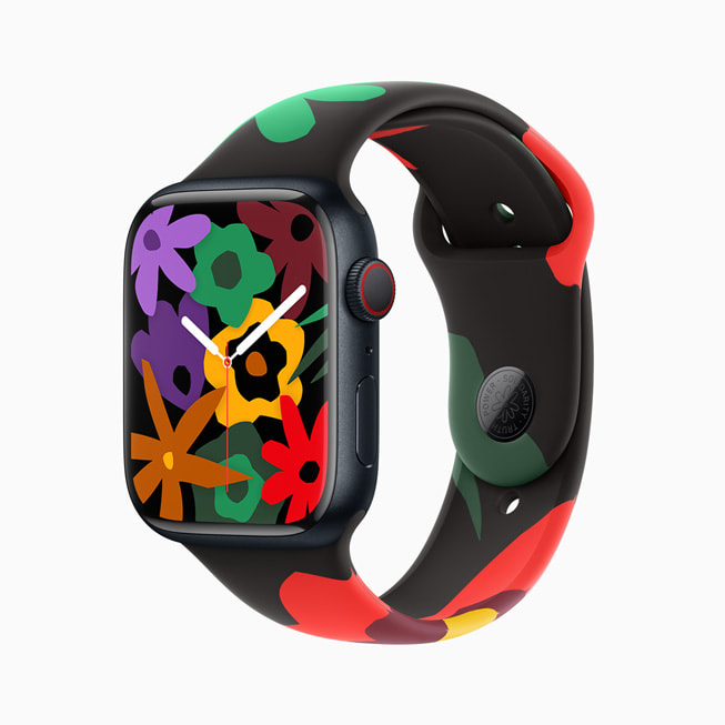 Apple Watch Series 9 is shown with the new Black Unity Collection band and face; in this image, the face has a cluster of blooms in a rainbow of colours.