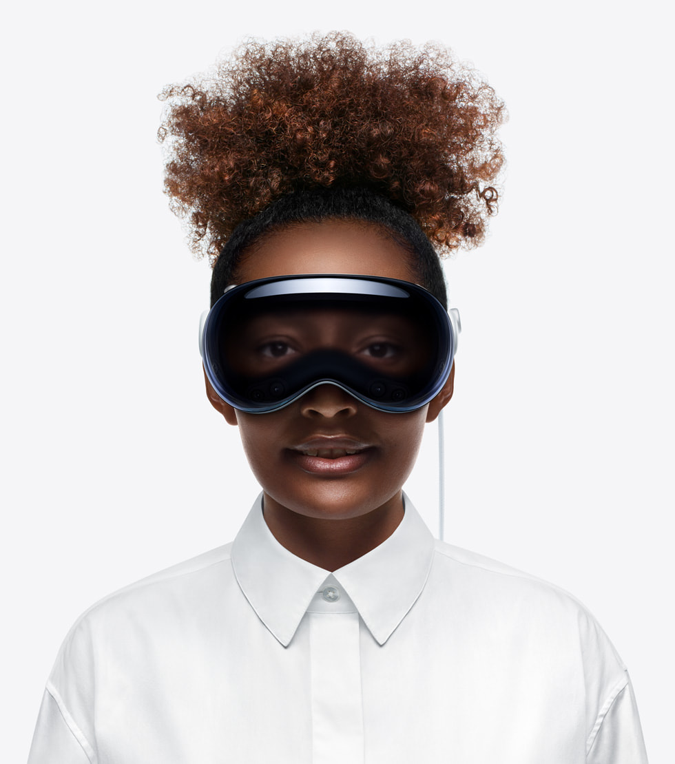 A woman wearing Apple Vision Pro.