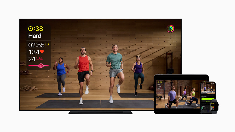 A new Apple Fitness+ workout with Joe Wicks is shown on Apple TV, iPad, iPhone 15 Pro, and Apple Watch Series 9.
