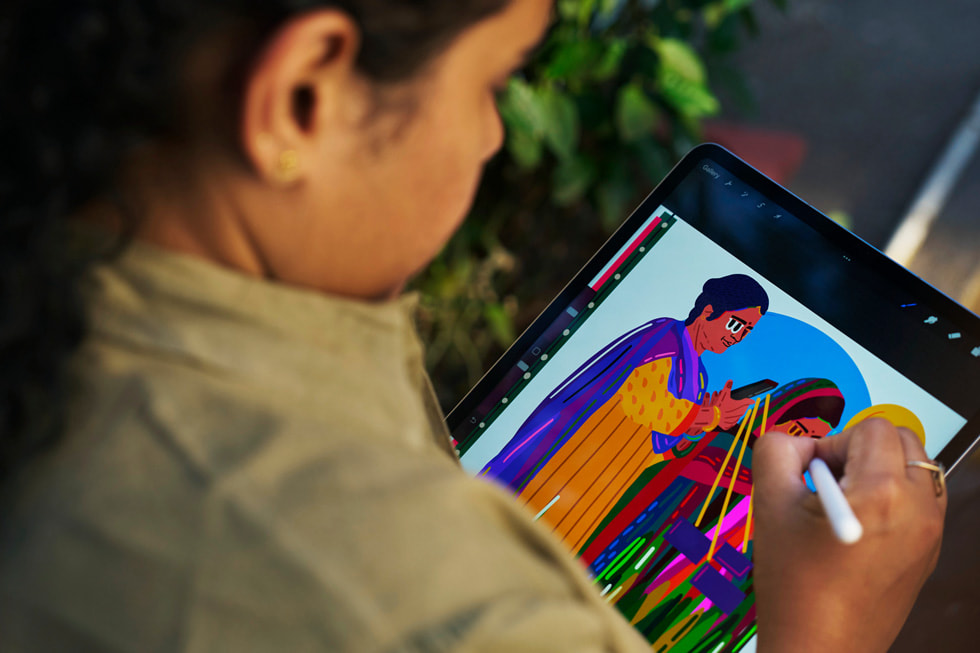 A closeup shows Sadhna Prasad using Apple Pencil with iPad Pro.
