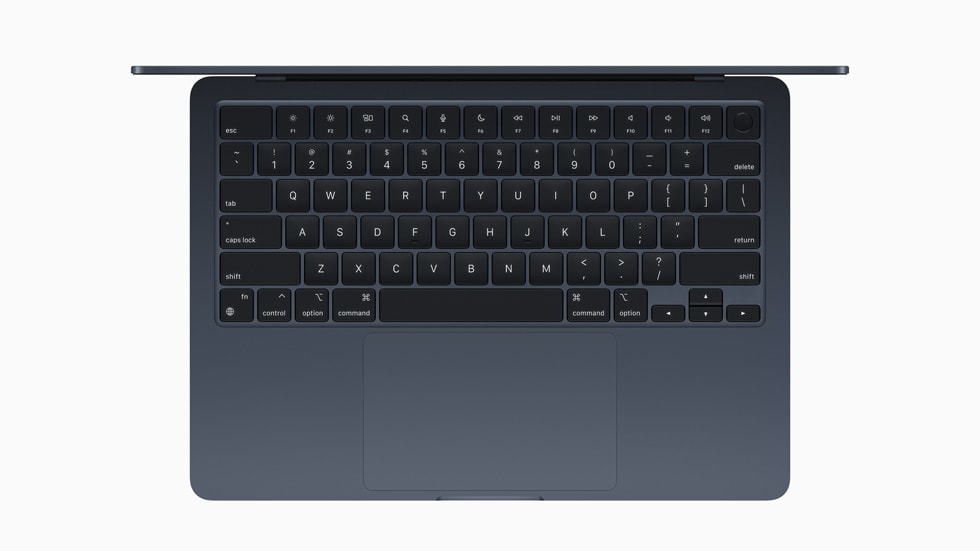 A close-up on the keyboard of the new MacBook Air, shown in midnight.