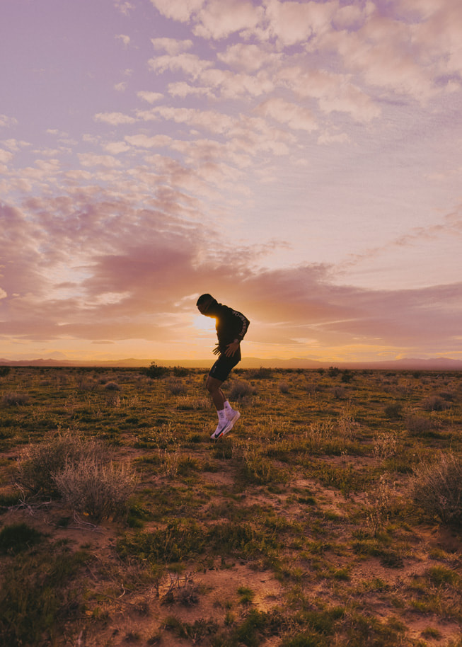 Angelo Antonio running at sunset. 