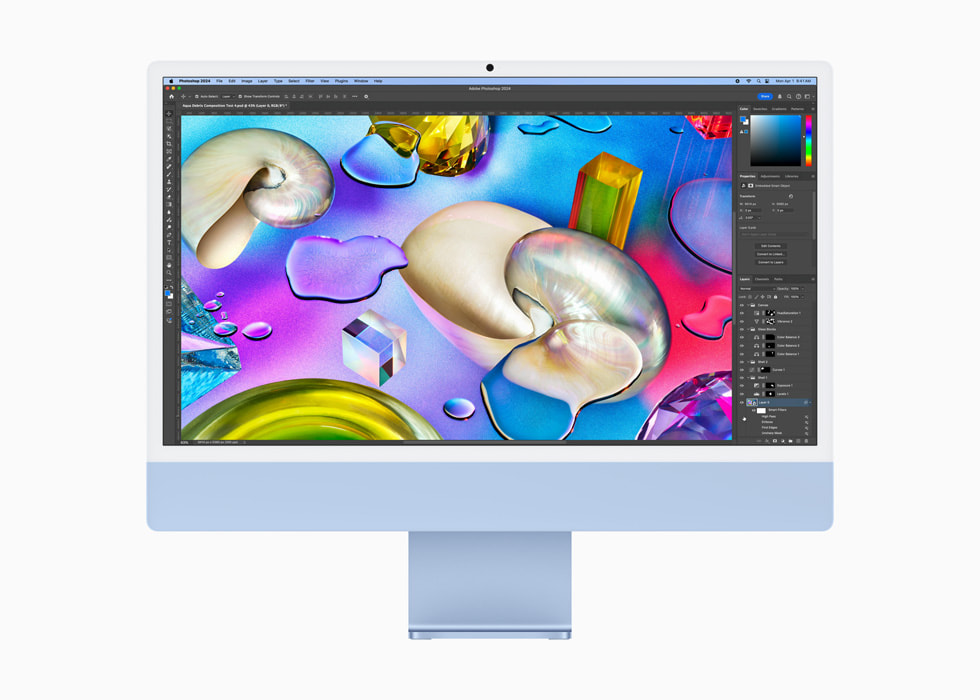 Apple 今日推出新款 M4 iMac,搭載強大的 M4 晶片並帶來鮮亮新色 6 一位使用者在藍色 iMac 上使用《Photoshop》。