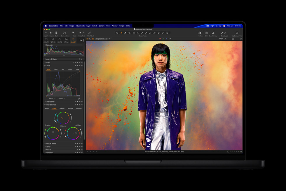 The new MacBook Pro is shown open with a Capture One editing screen.