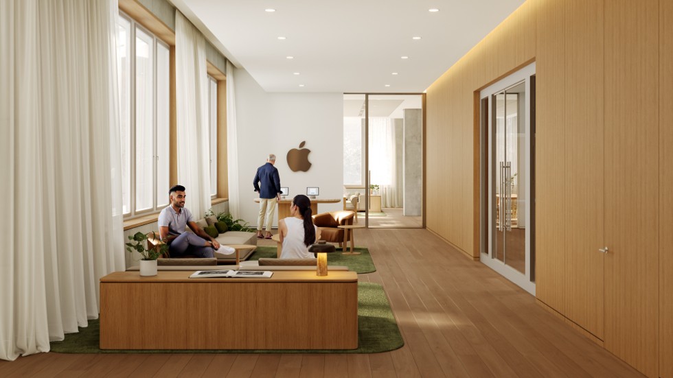 Drie mensen die op een lange houten bank zitten in een minimalistische ontvangstruimte met lichtgekleurde wanden met houten panelen en een groen tapijt.