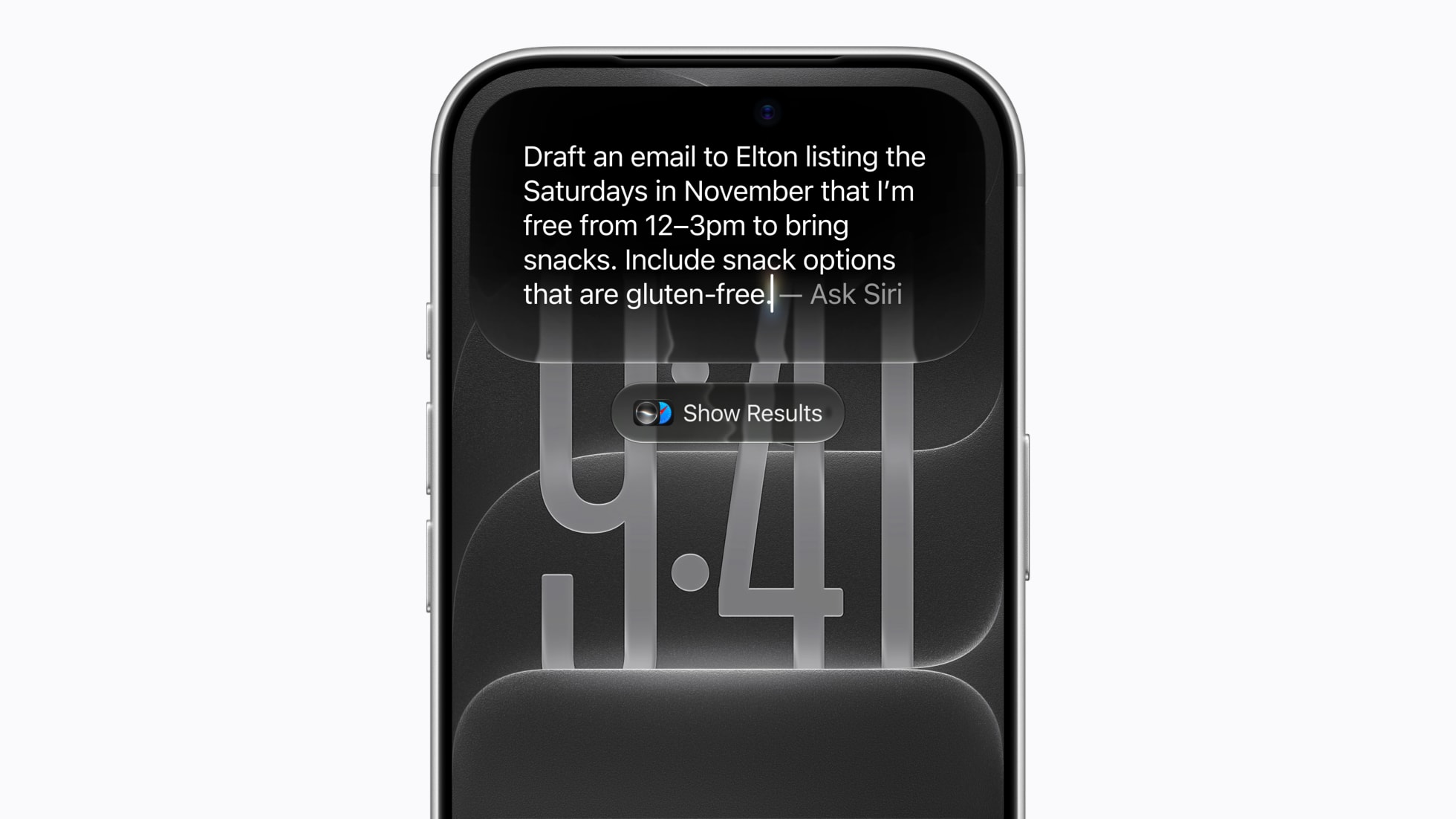 The top of an iPhone Lock Screen showing a typed Siri request to draft an email listing free Saturdays in November, with a Show Results button below