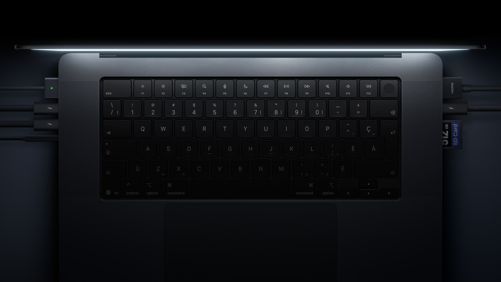 A close-up of the keyboard and ports on MacBook Pro with PROLED XDR Display.