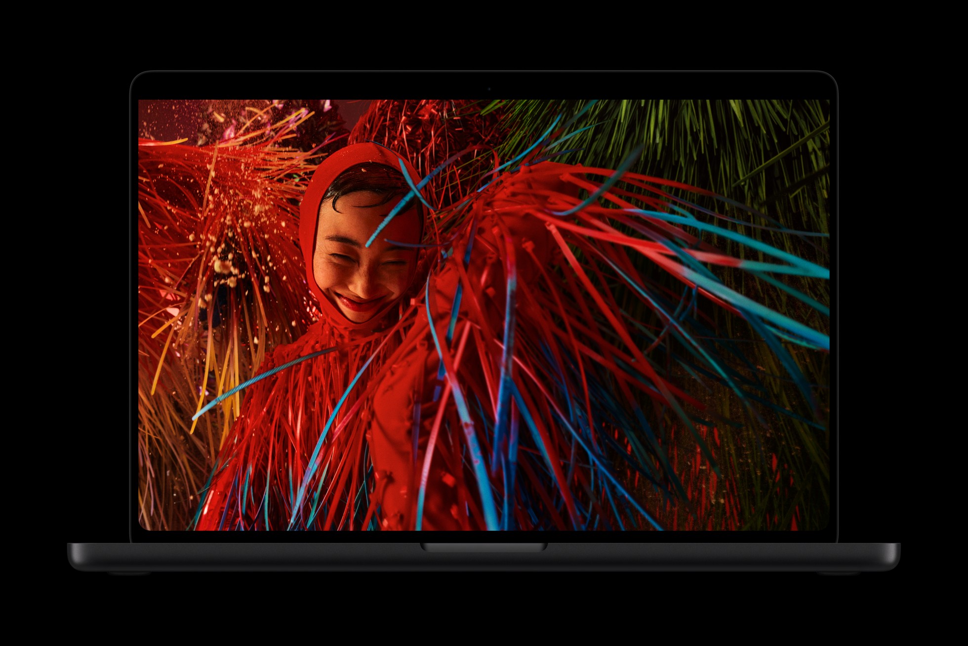 MacBook Pro displaying a colorful image on the PROLED XDR screen