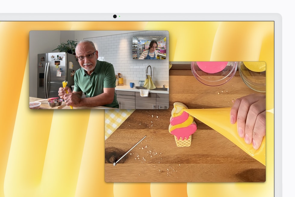 Two users interact via video call while an overhead view of a countertop shows a cookie being decorated.