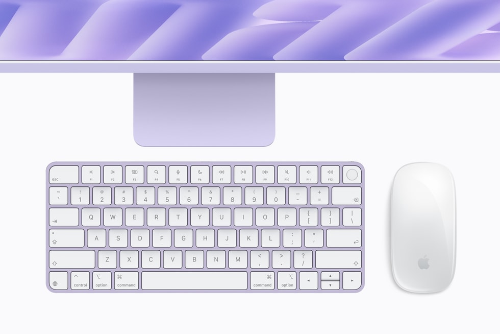 A colour-matched keyboard and mouse sit below iMac with M6 in purple.